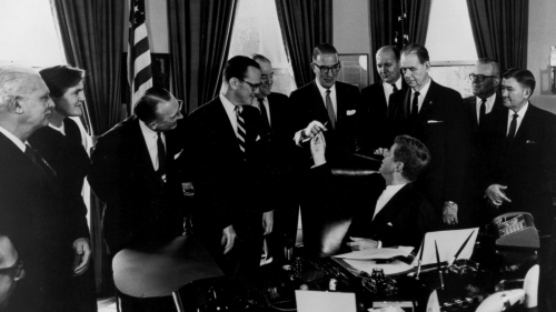 President John F. Kennedy hands Sen. Estes Kefauver the pen he used to sign the 1962 Amendments to the Federal Food, Drug and Cosmetic (FD&C) Act. Those looking on include Frances Kelsey, second from left, the FDA medical officer who refused to approve the new drug application for Kevadon, the brand name for thalidomide in the United States.