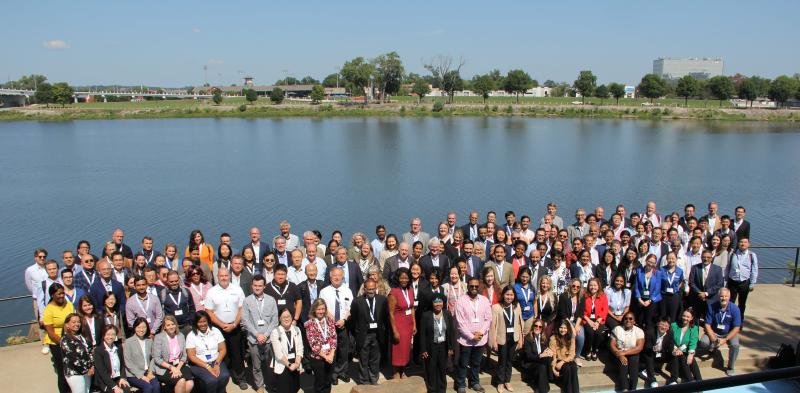 Group of GSRS24 attendees standing in front of the Arkansas River in Little Rock, AR