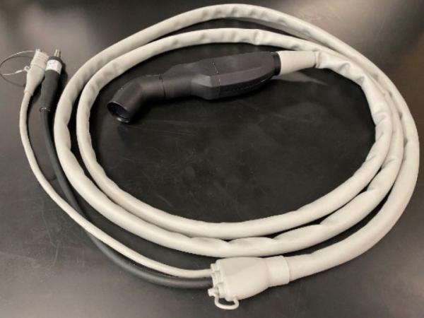 Handheld probe with cables to connect to light source and USB hub.