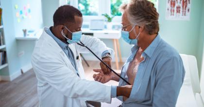 Doctor testing a patient's lungs