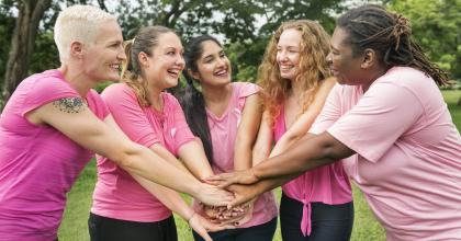 Ethnically diverse women in pink observing breast cancer awareness month