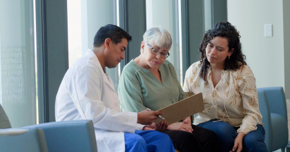 Two people meeting with health care provider.