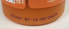 Image of Best by date on Tropical Roots Bottle